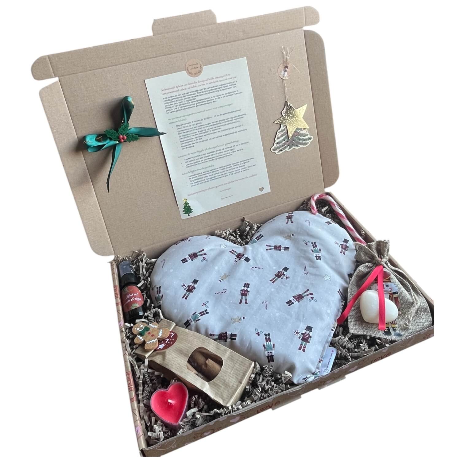 Feestelijk kerstcadeau, met een verwarmbaar hart en snoepjes