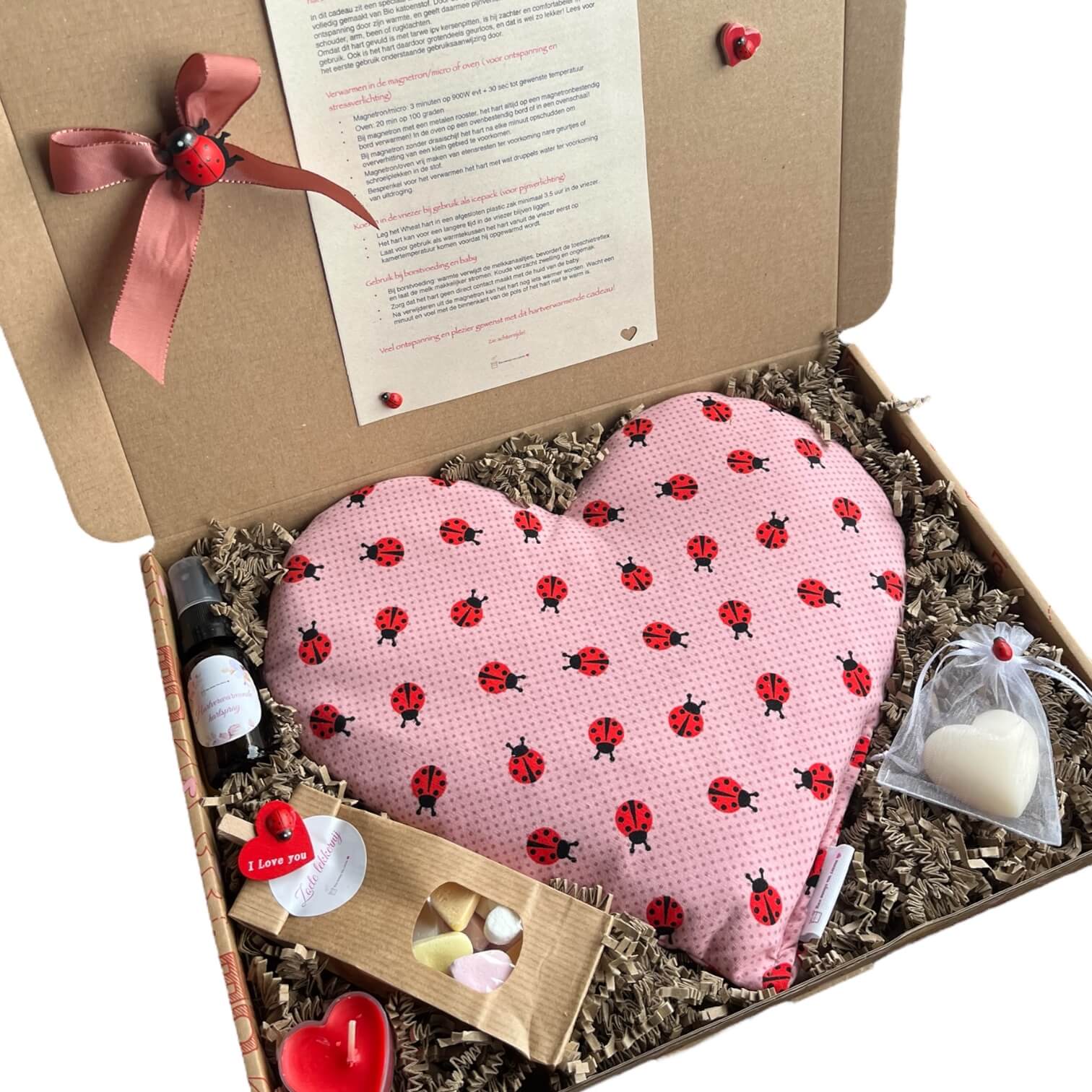 Liefdevol brievenbuscadeau met verwarmbaar hart met lieveheersbeestje motief