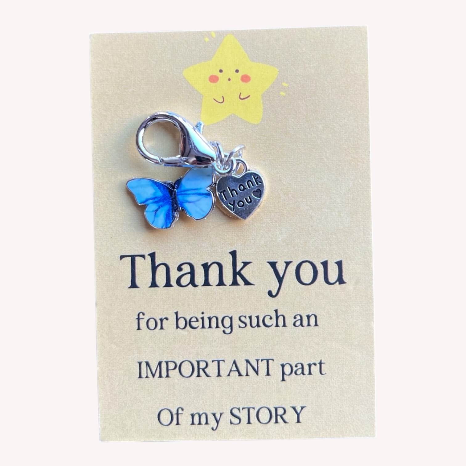 Vlinderhangertje met bloem als bedankje